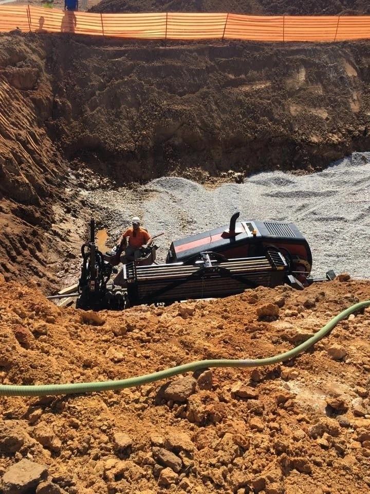 Ditch Witch JT20 directional drill boring in a deep entry pit