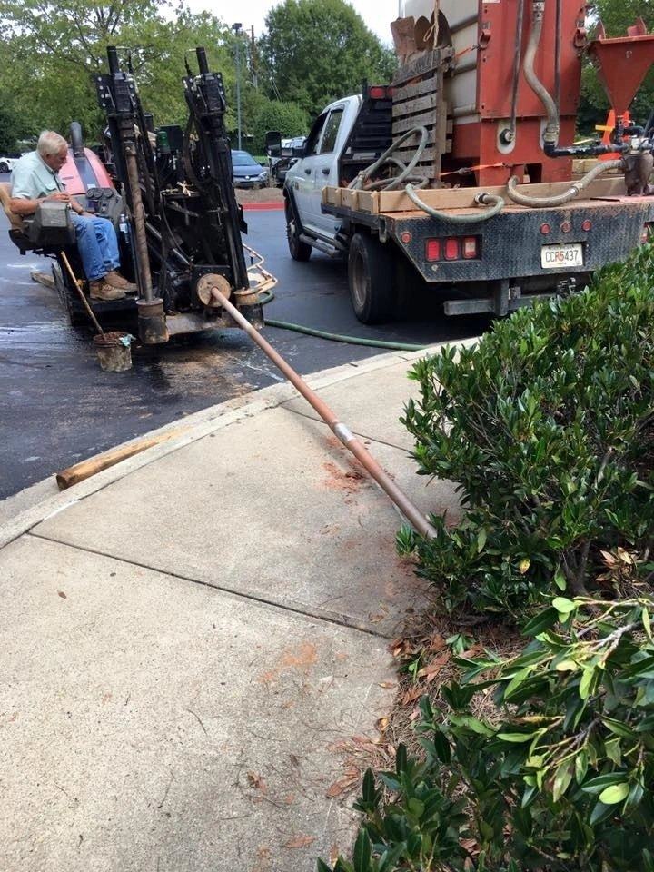 Directional boring under a driveway and sidewalk with no open trench for a residential utility job